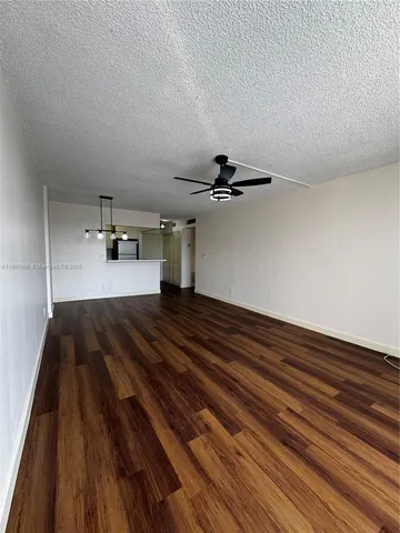 a view of a room with a wooden floor