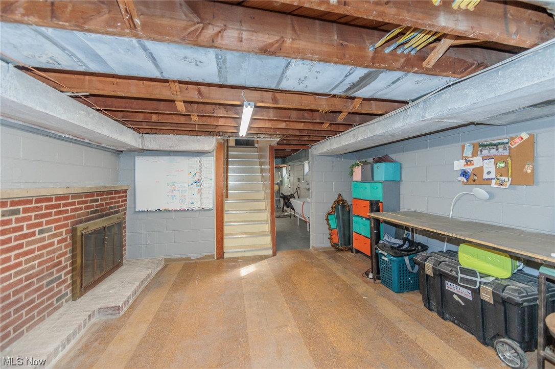 12273 Huffman Road Cleveland, OH 44130 - Photo 39 of 46 Basement with a brick fireplace