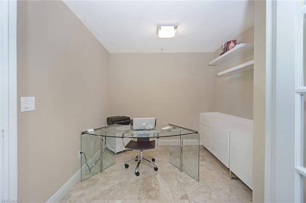 265 Indies Way, Unit 701 Naples, FL 34110 - Photo 12 of 36 a room with storage and utility