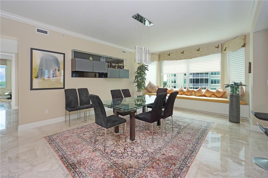 265 Indies Way, Unit 701 Naples, FL 34110 - Photo 7 of 36 a living room with furniture and rug