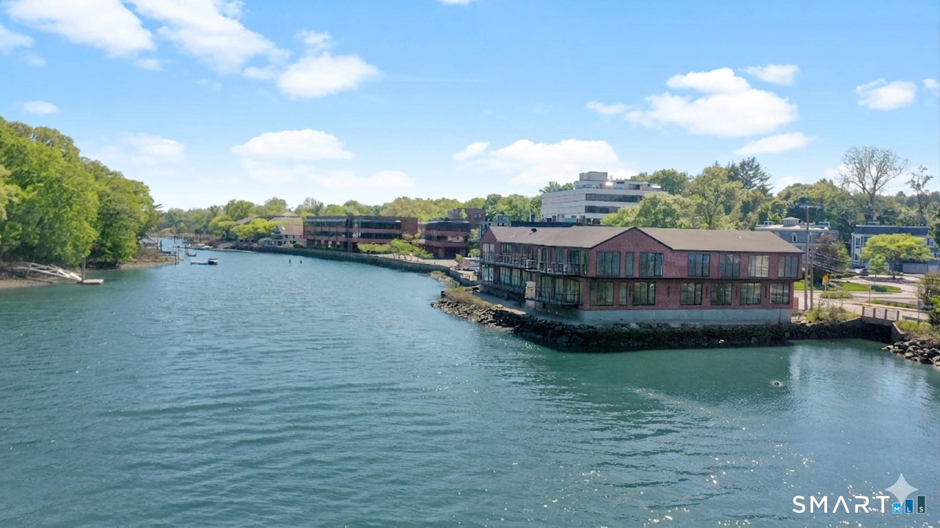 253 Riverside Avenue, Unit 101 Westport, CT 06880 - Photo 13 of 14 a view of a lake in front of house
