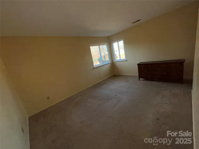 a bathroom with a toilet and shower