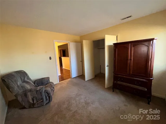 a view of hallway with wooden floor