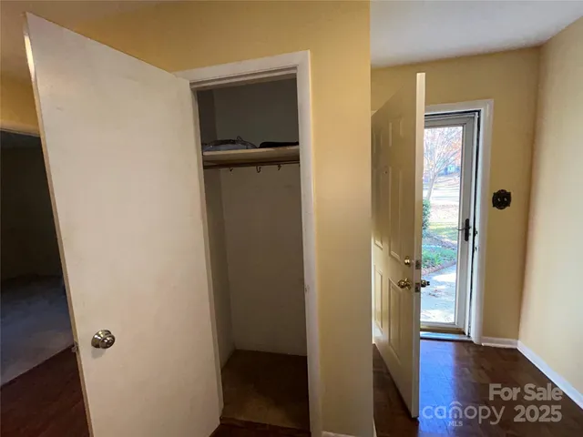 a room with gym equipment and a fireplace