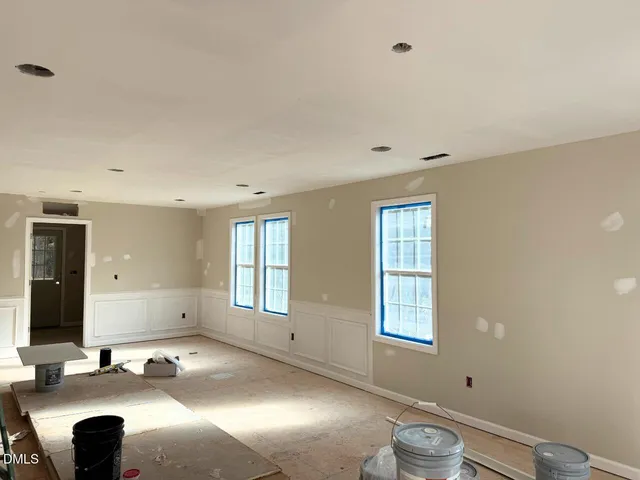 a view of a room with gym equipment and windows