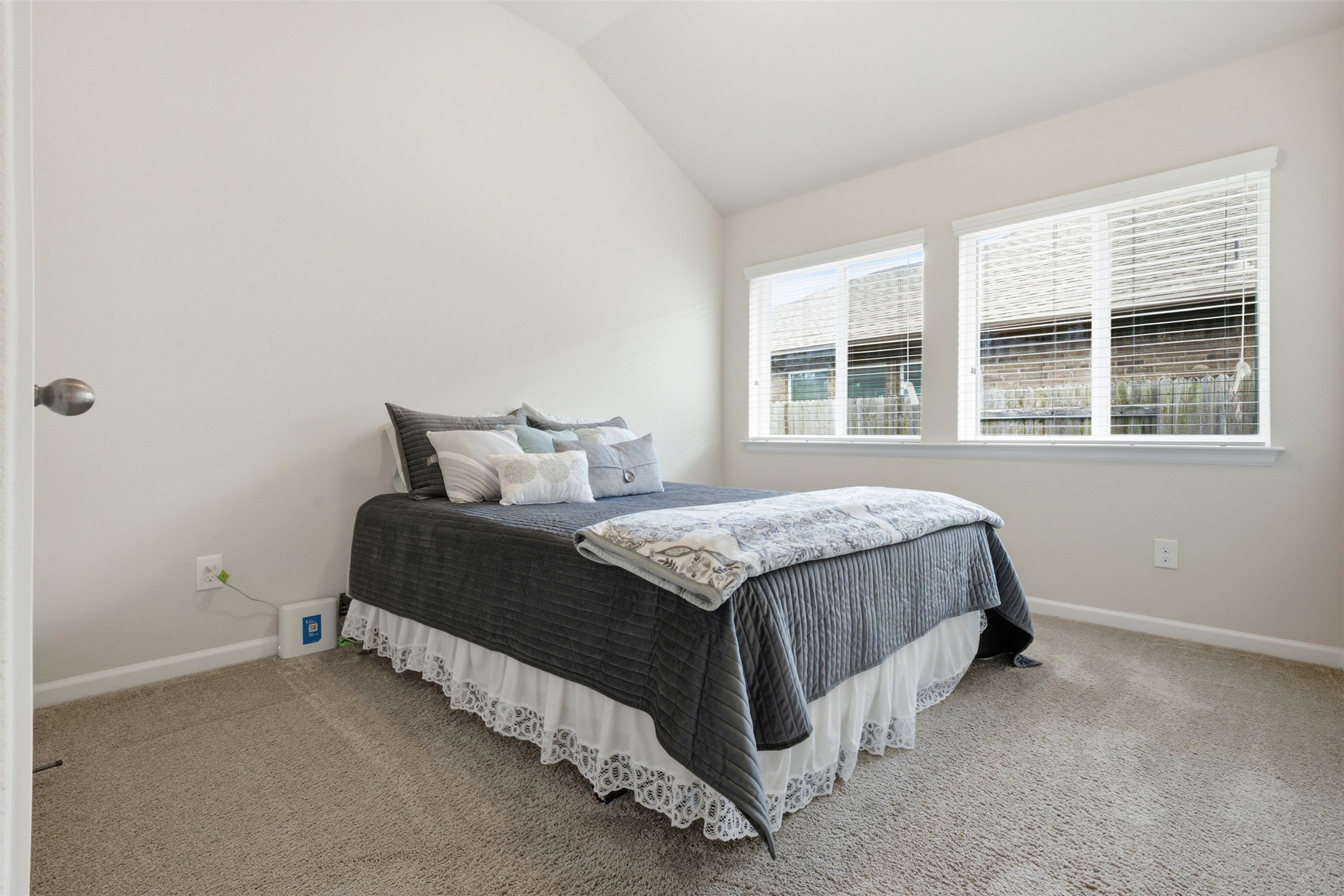 276 Gunnison Way Kyle, TX 78640 - Photo 18 of 28 a spacious bedroom with a bed and window