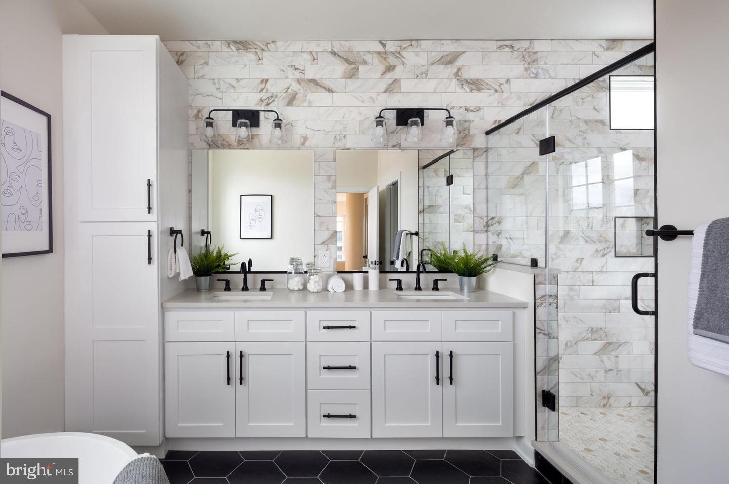 3401 Hamilton Street, Unit 13 Philadelphia, PA 19104 - Photo 26 of 33 a spacious bathroom with a granite countertop sink mirror and shower
