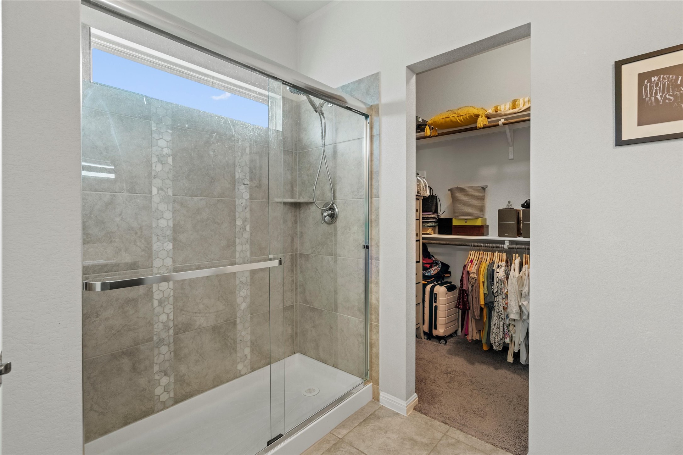 8144 Daisy Cutter Crossing Georgetown, TX 78626 - Photo 15 of 40 Full bath with tile patterned floors, a walk in closet, and a stall shower