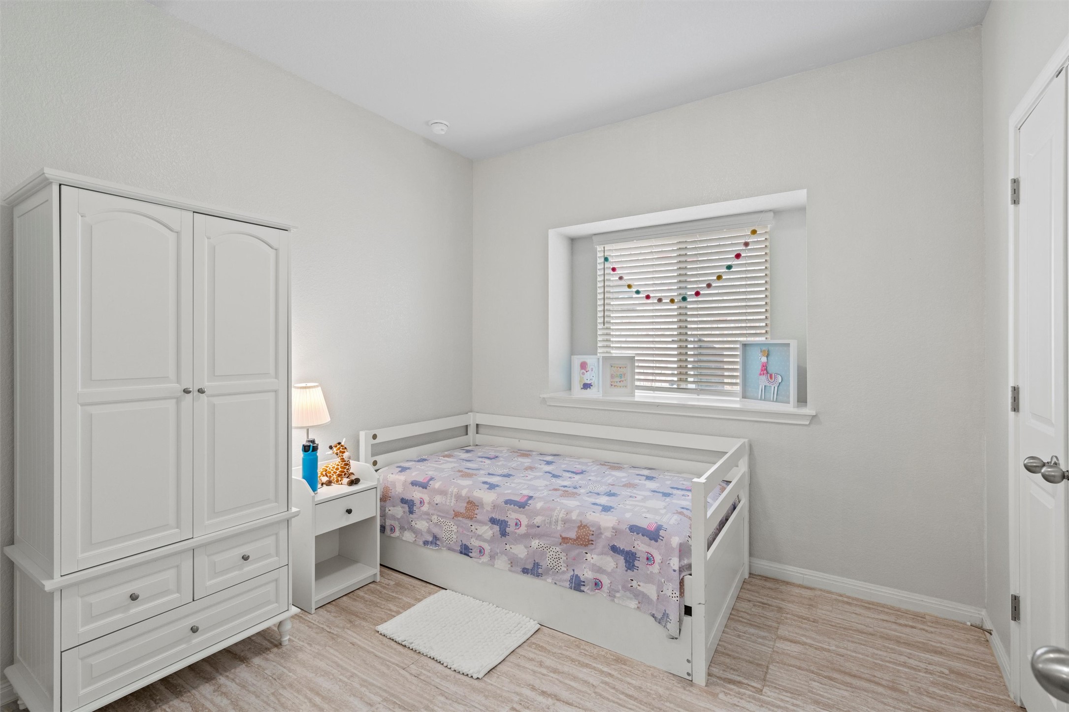 8144 Daisy Cutter Crossing Georgetown, TX 78626 - Photo 17 of 40 Bedroom featuring baseboards and light wood-type flooring