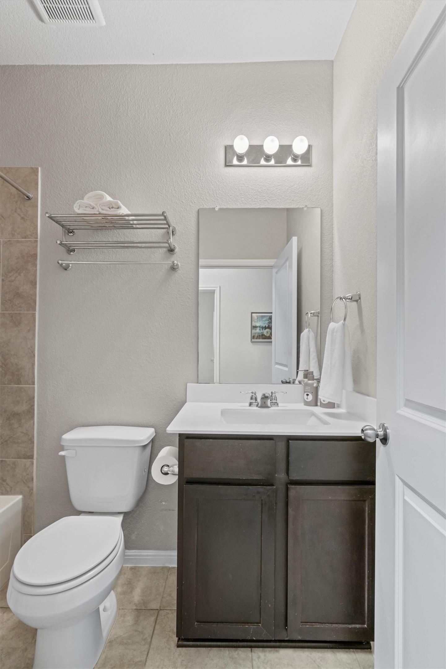 8144 Daisy Cutter Crossing Georgetown, TX 78626 - Photo 20 of 40 Bathroom featuring tile patterned flooring, vanity, toilet, baseboards, and visible vents