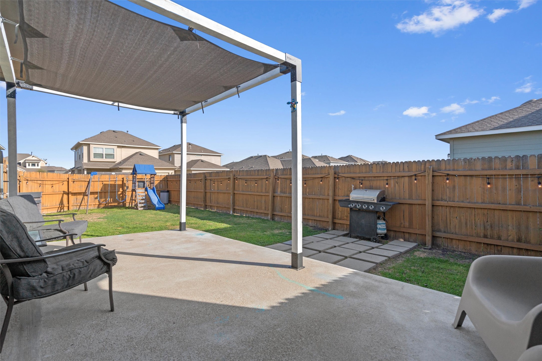 8144 Daisy Cutter Crossing Georgetown, TX 78626 - Photo 24 of 40 View of patio / terrace featuring a fenced backyard, a playground, area for grilling, and a pergola