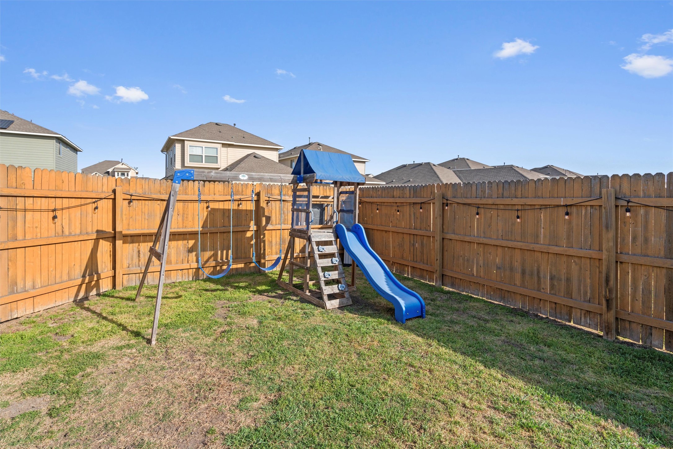 8144 Daisy Cutter Crossing Georgetown, TX 78626 - Photo 26 of 40 View of playground featuring a fenced backyard and a lawn