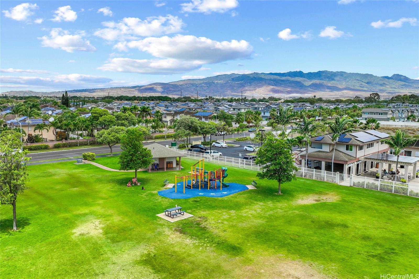 91-1010 Huliau Street, Unit 5C Ewa Beach, HI 96706 - Photo 15 of 16 a view of a city with mountains in the background