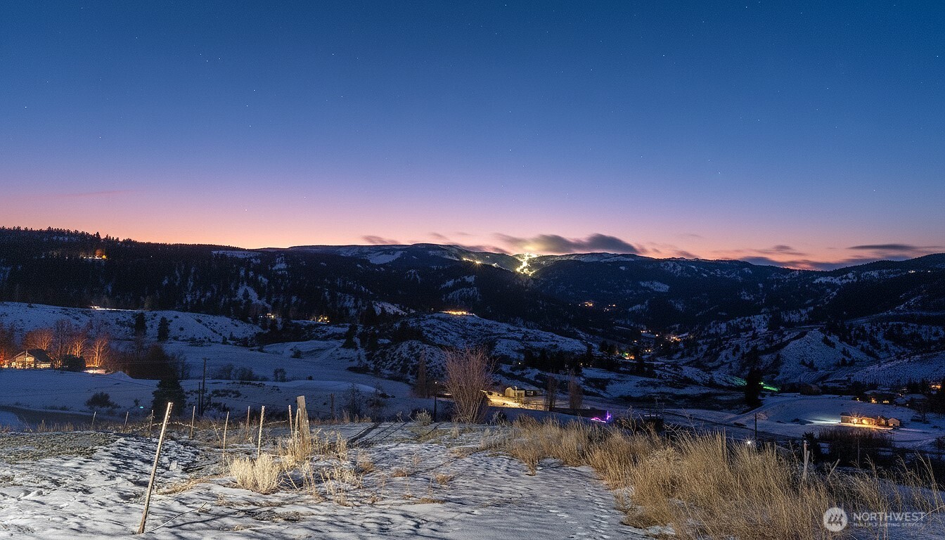 5-nna Wheeler Hill Road, Unit LOT E Wenatchee, WA 98801 - Photo 6 of 13 a view of a lake with a mountain