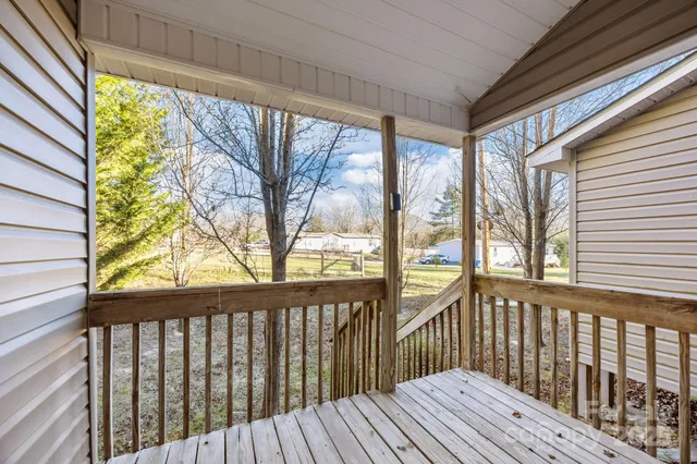 a view of balcony with wooden floor