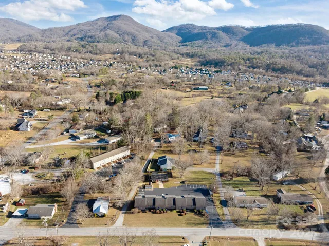 an aerial view of residential houses and outdoor space