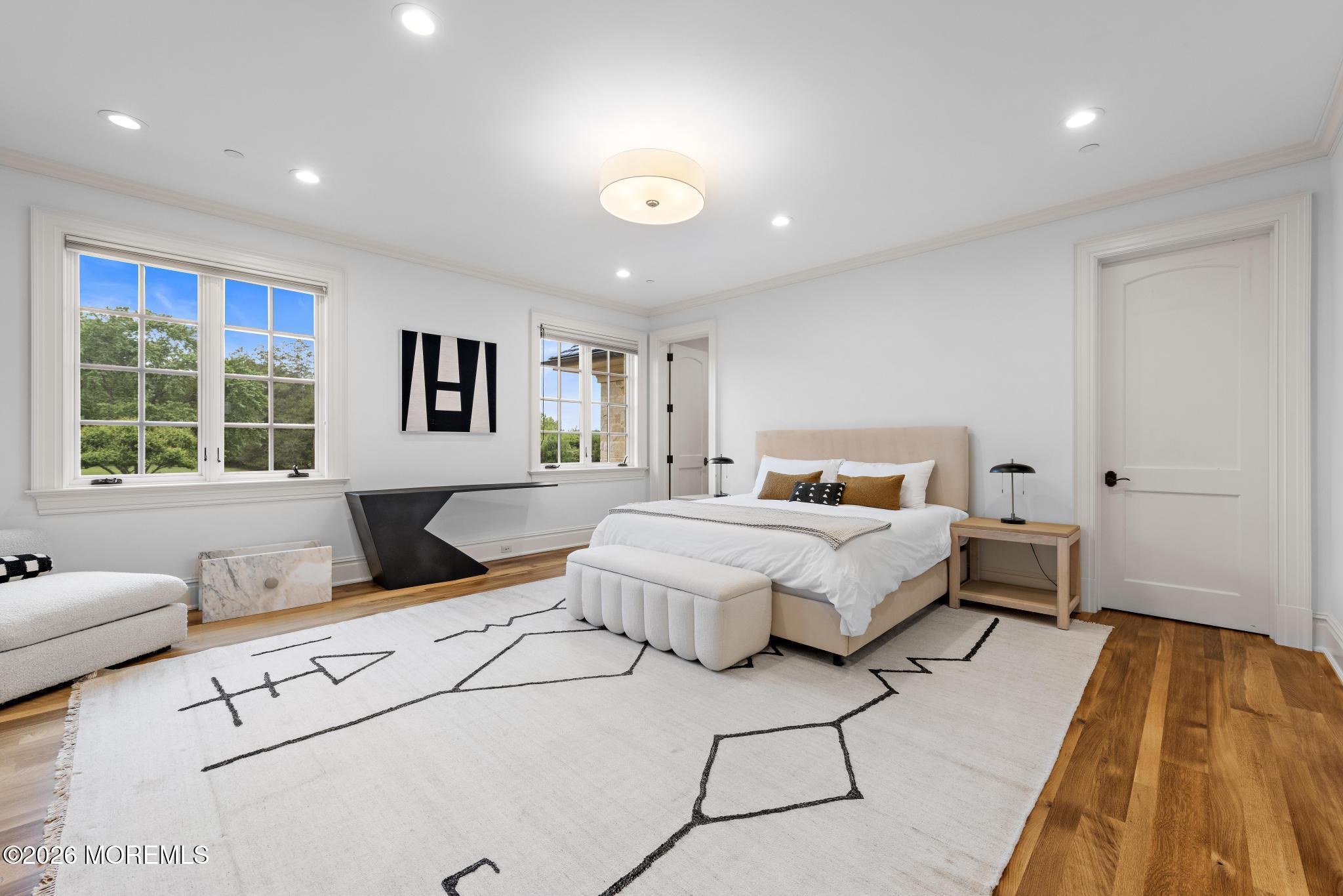 88 Montrose Road Colts Neck, NJ 07722 - Photo 36 of 73 a spacious bedroom with a large bed and a window