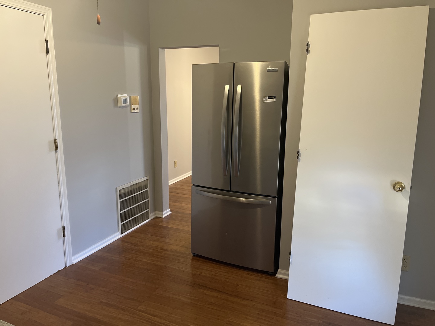 305 North View Street, Unit 2 Aurora, IL 60506 - Photo 6 of 9 a view of a kitchen with wooden floor and a refrigerator