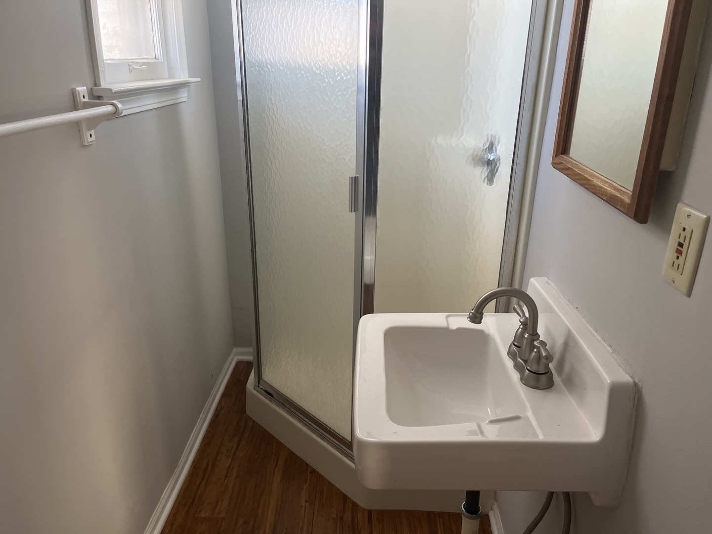 305 North View Street, Unit 2 Aurora, IL 60506 - Photo 7 of 9 a bathroom with a sink and mirror