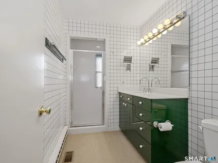a bathroom with a double vanity sink and mirror