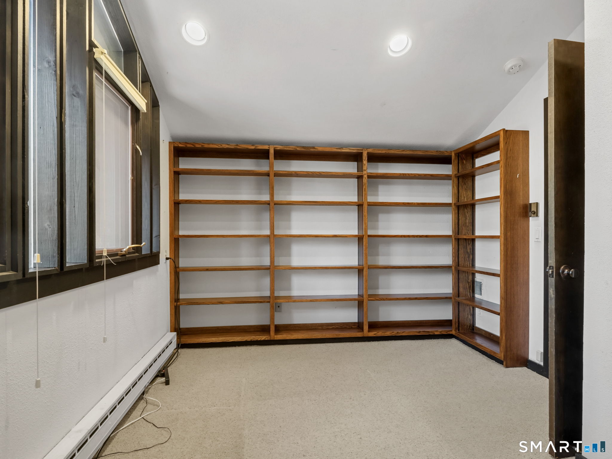 484 Cognewaugh Road Greenwich, CT 06807 - Photo 28 of 32 a view of an empty room with a window