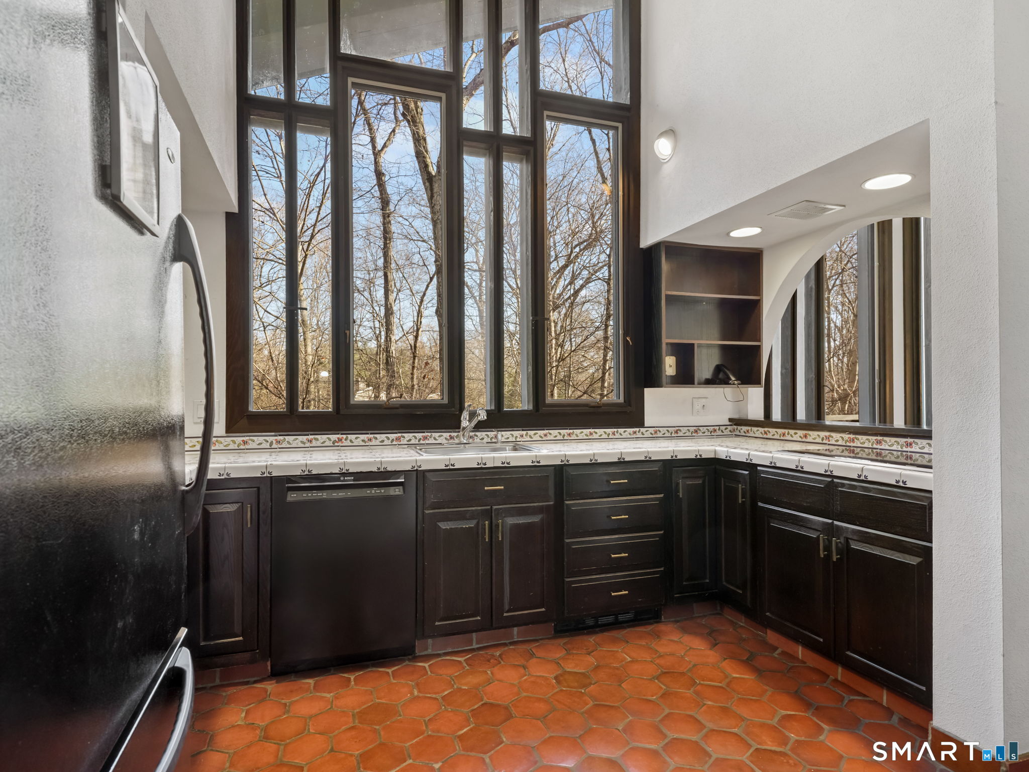 484 Cognewaugh Road Greenwich, CT 06807 - Photo 7 of 32 a bathroom with a sink and a large mirror