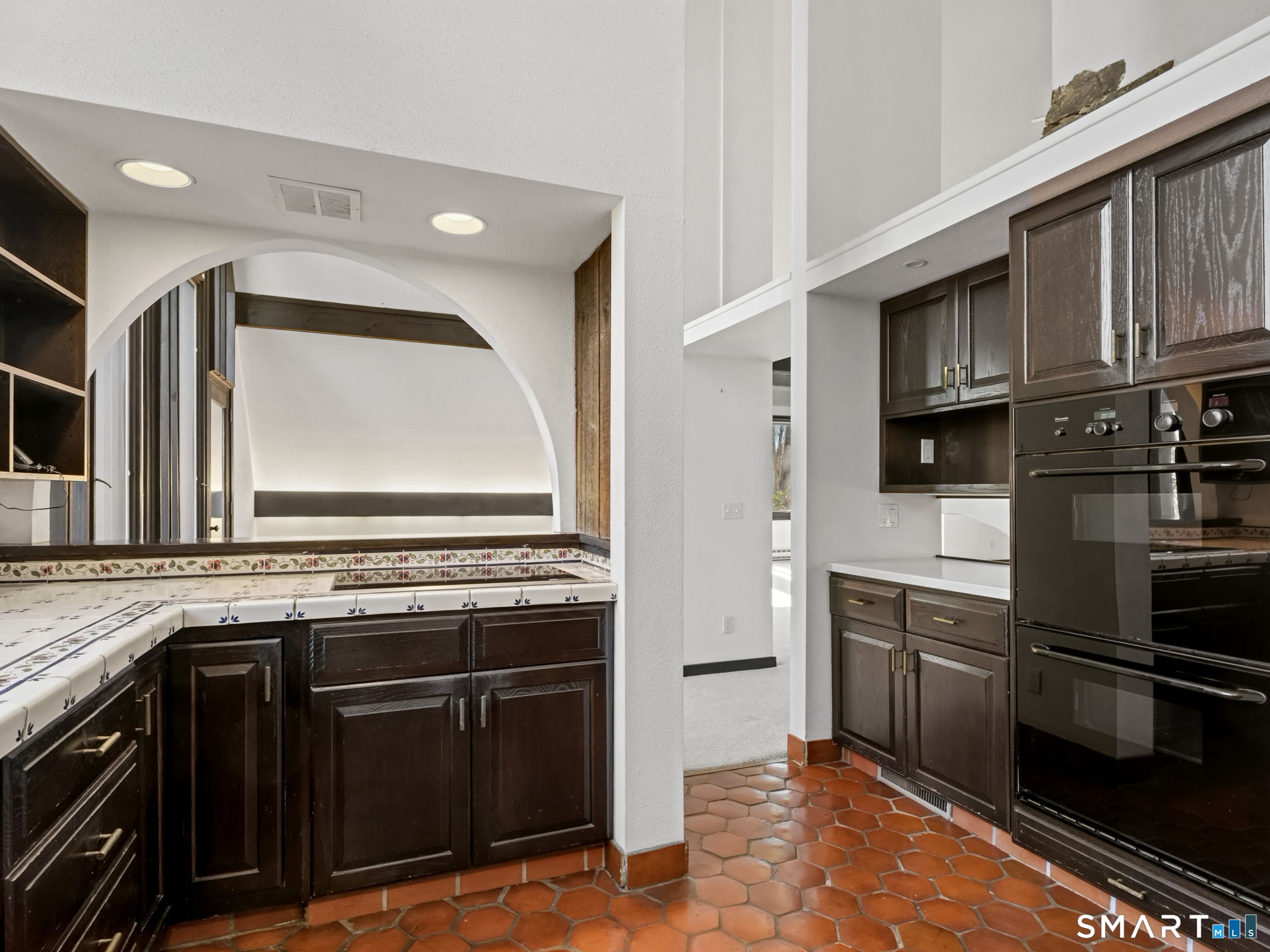 484 Cognewaugh Road Greenwich, CT 06807 - Photo 8 of 32 a kitchen with stainless steel appliances granite countertop a stove microwave and cabinets