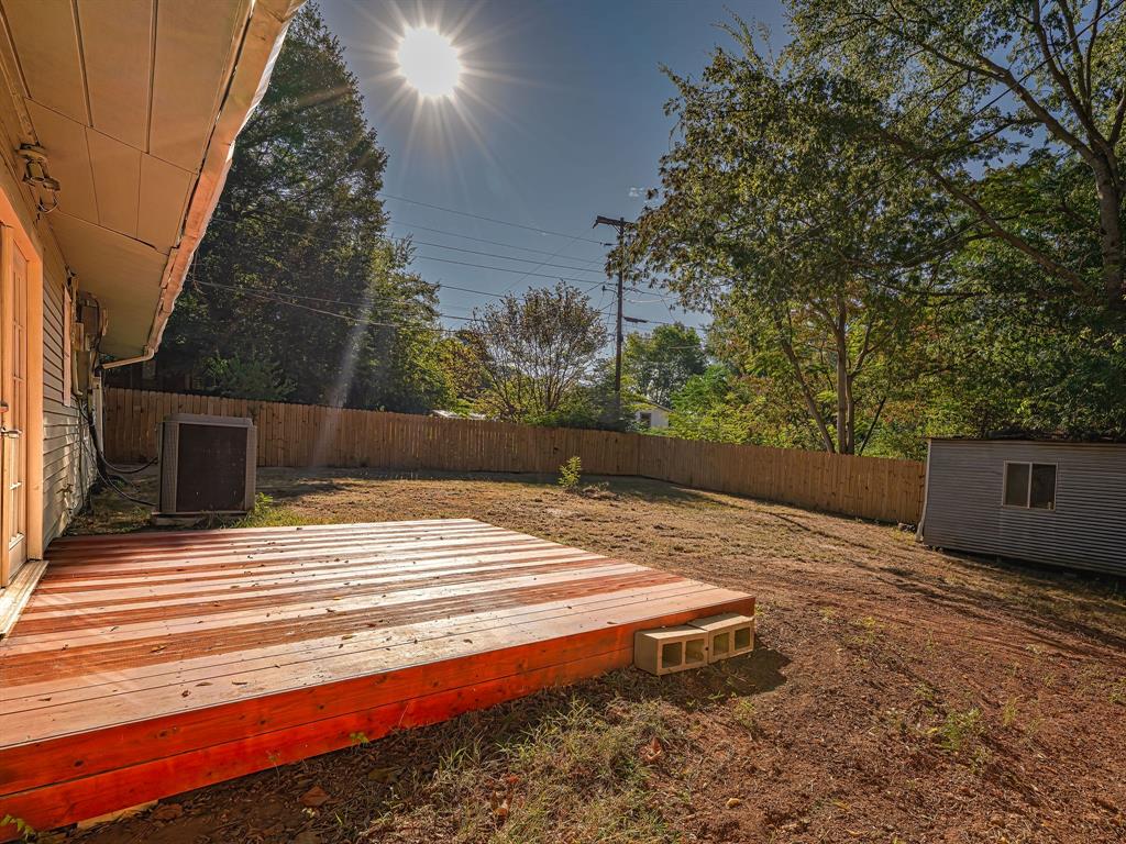 312 Germany Street Lone Star, TX 75668 - Photo 3 of 18 a view of backyard with wooden fence