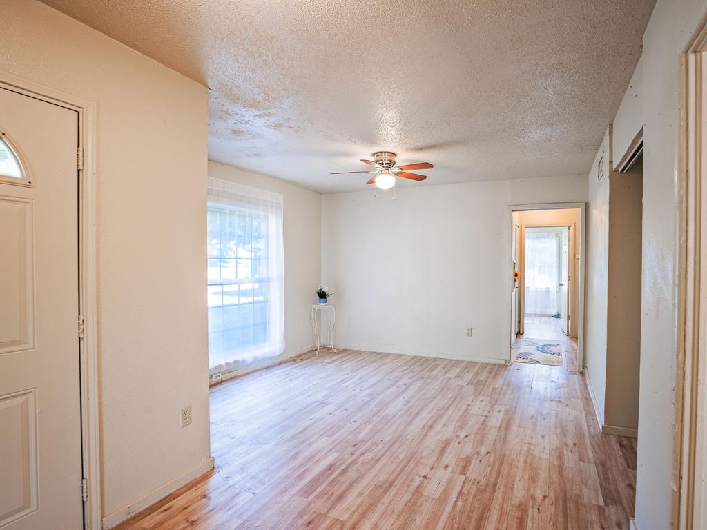 312 Germany Street Lone Star, TX 75668 - Photo 9 of 18 a view of an empty room with wooden floor