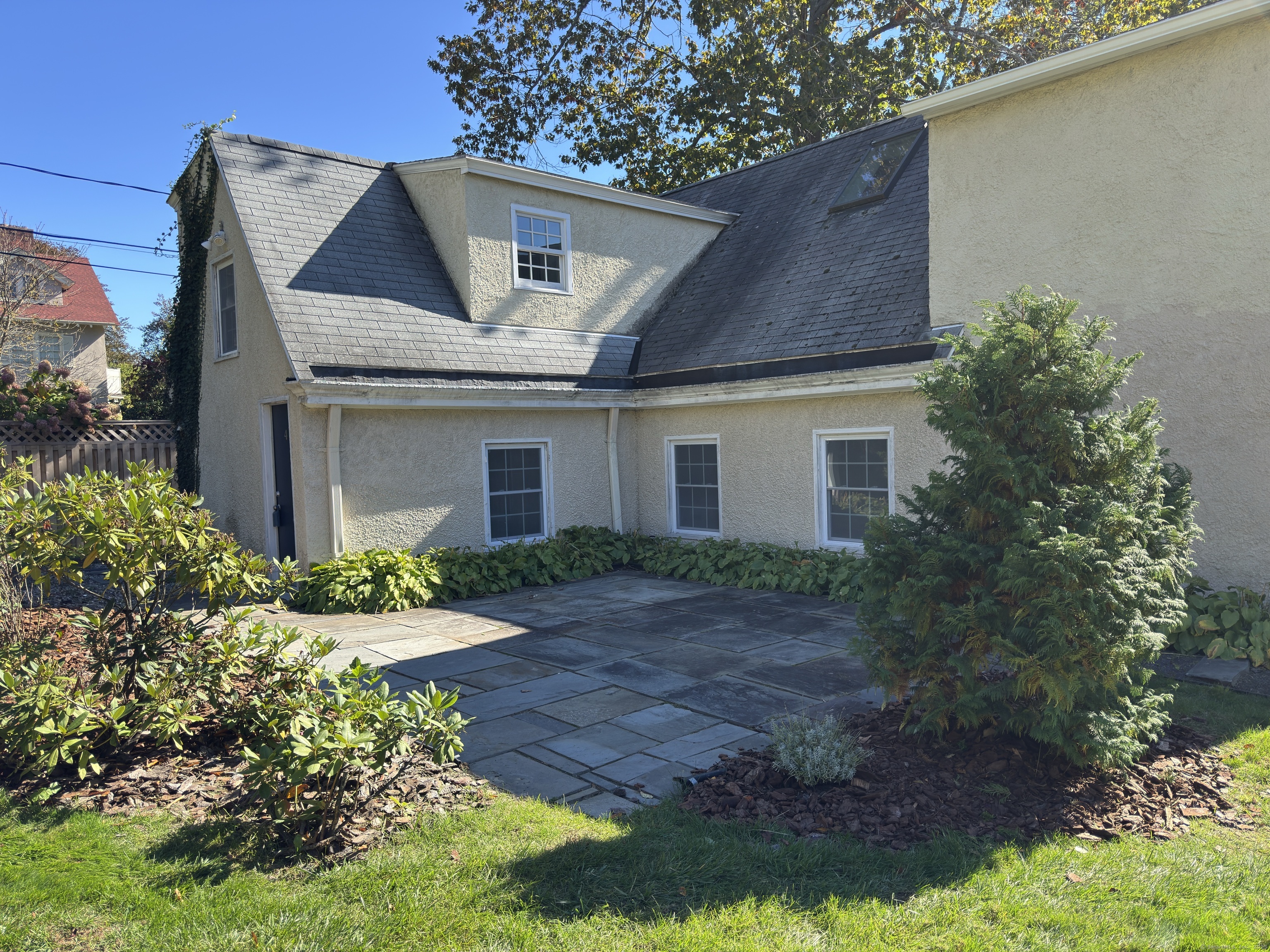 4 Sycamore Lane West Hartford, CT 06117 - Photo 1 of 19 a front view of house with a garden