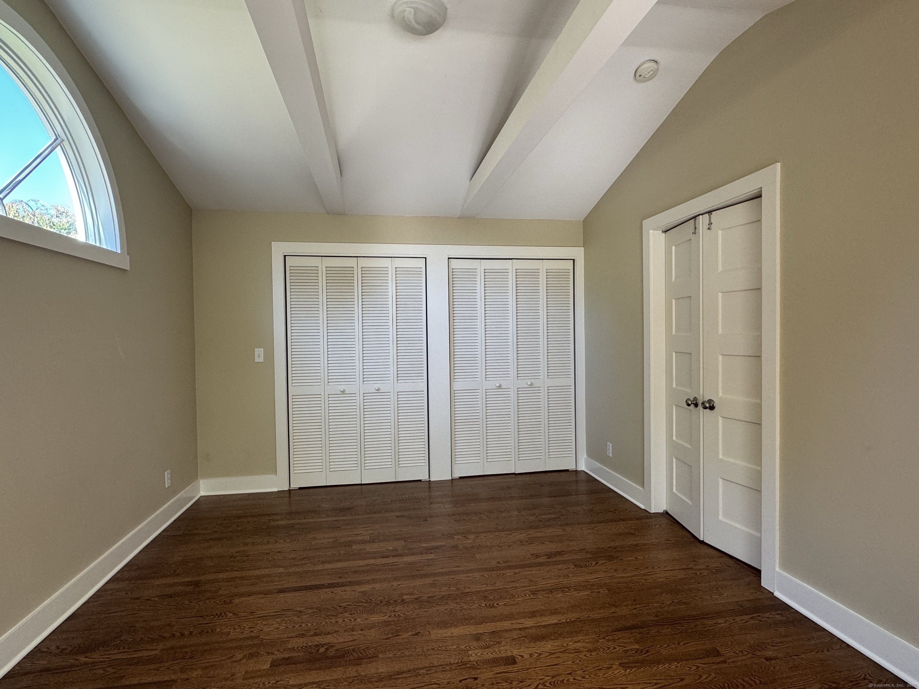 4 Sycamore Lane West Hartford, CT 06117 - Photo 11 of 19 a view of an empty room with wooden floor and a window
