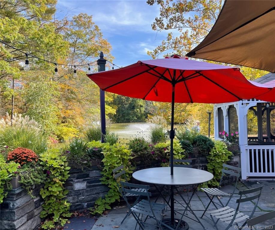 4 Sycamore Lane West Hartford, CT 06117 - Photo 19 of 19 a view of a chair and table in the garden