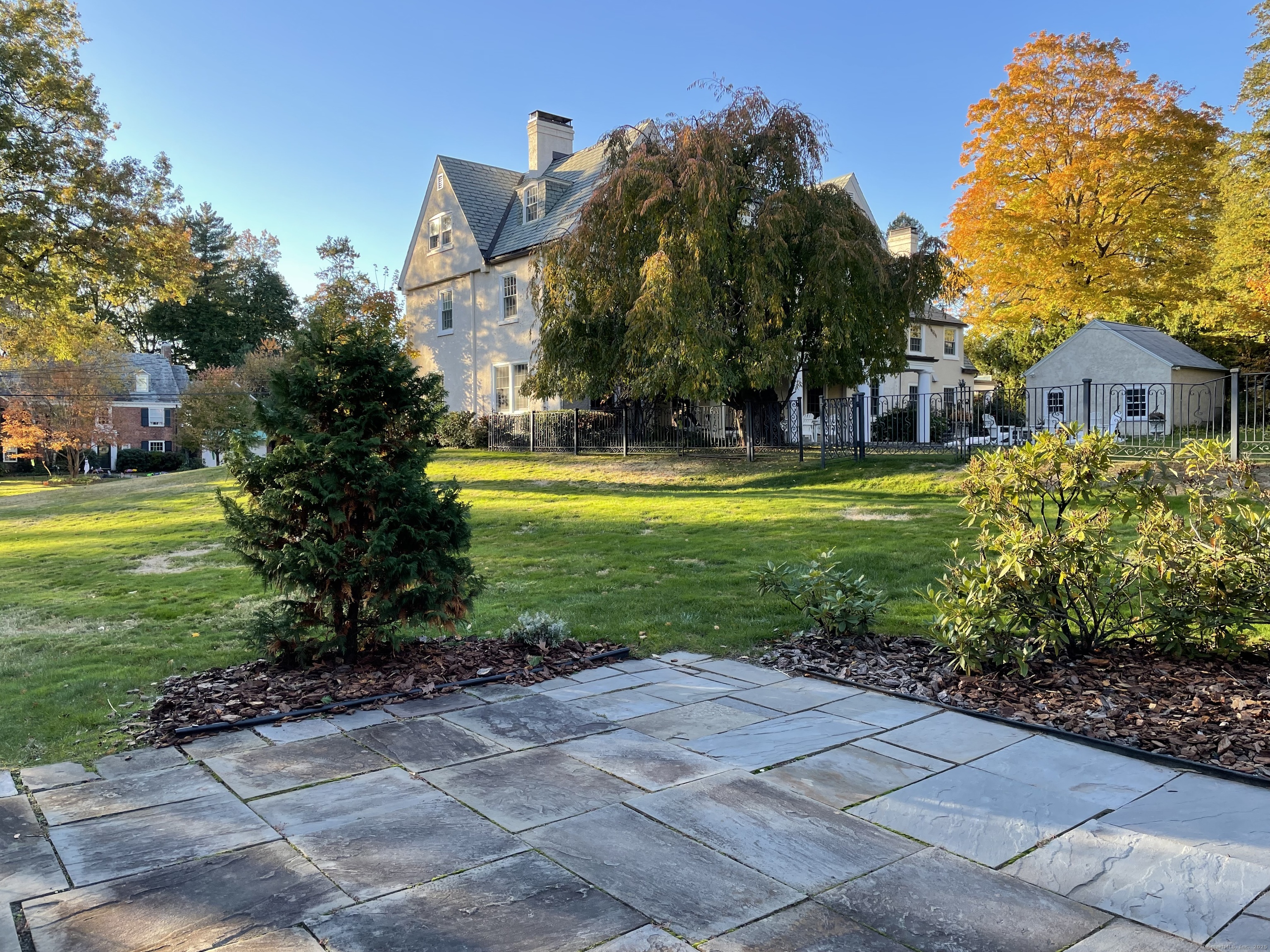 4 Sycamore Lane West Hartford, CT 06117 - Photo 2 of 19 a view of a house with a big yard and palm trees