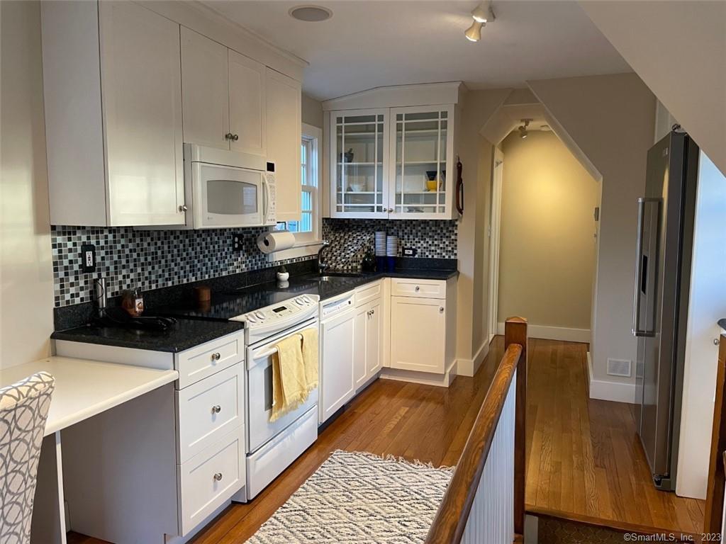 4 Sycamore Lane West Hartford, CT 06117 - Photo 4 of 19 a kitchen with a sink a stove and refrigerator