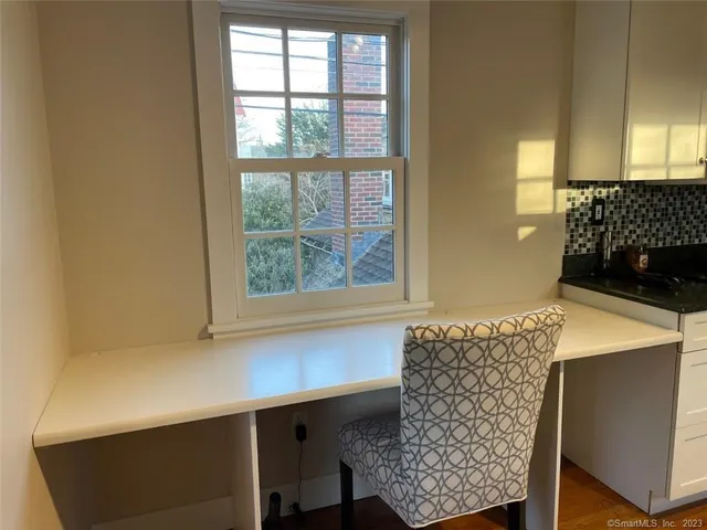 a living room with a couch and a large window