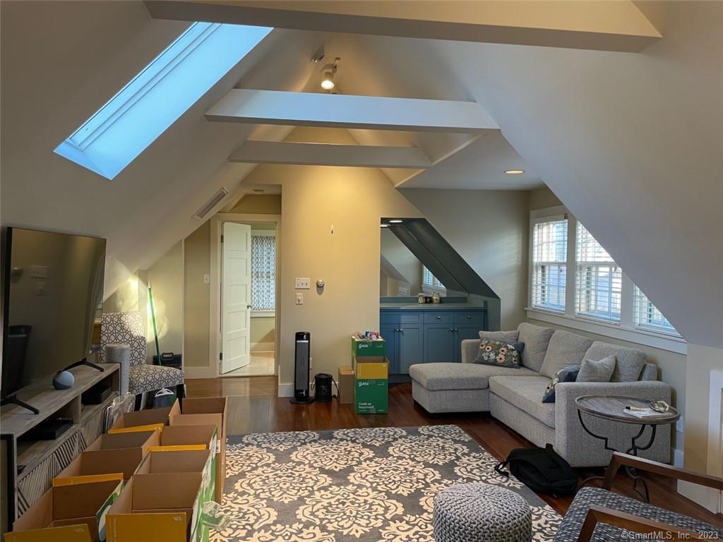 4 Sycamore Lane West Hartford, CT 06117 - Photo 8 of 19 a living room with furniture and a flat screen tv