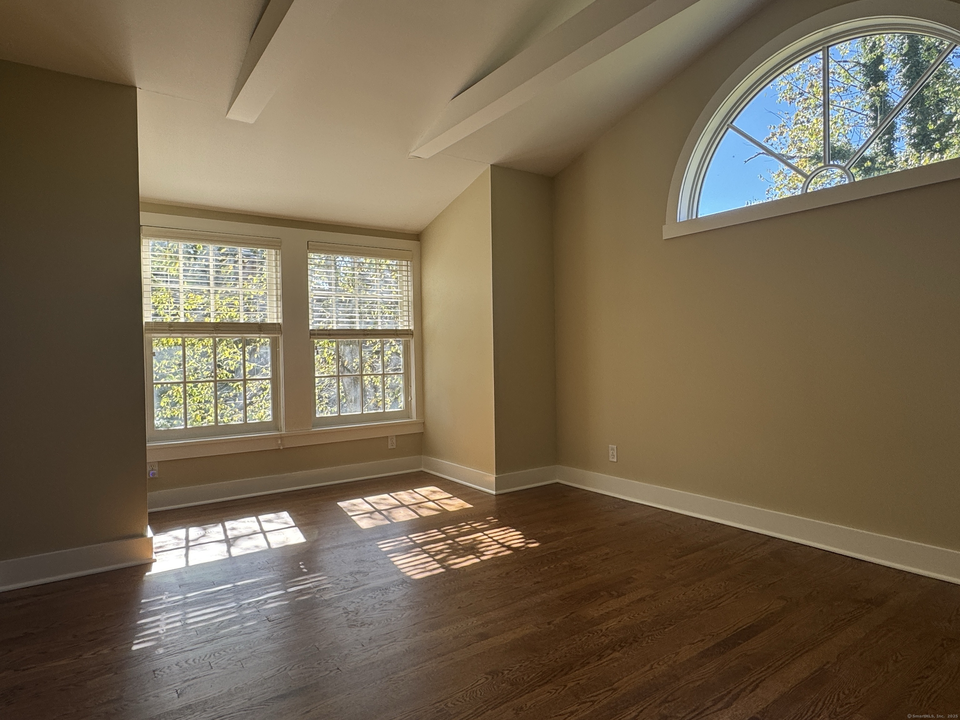4 Sycamore Lane West Hartford, CT 06117 - Photo 10 of 19 a view of empty room with wooden floor and fan