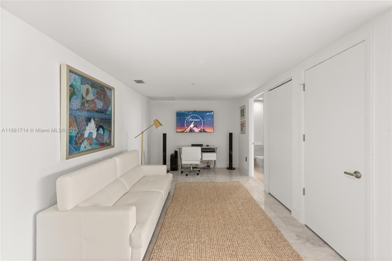 495 Brickell Avenue, Unit 5003 Miami, FL 33131 - Photo 16 of 21 a living room with furniture and a couch