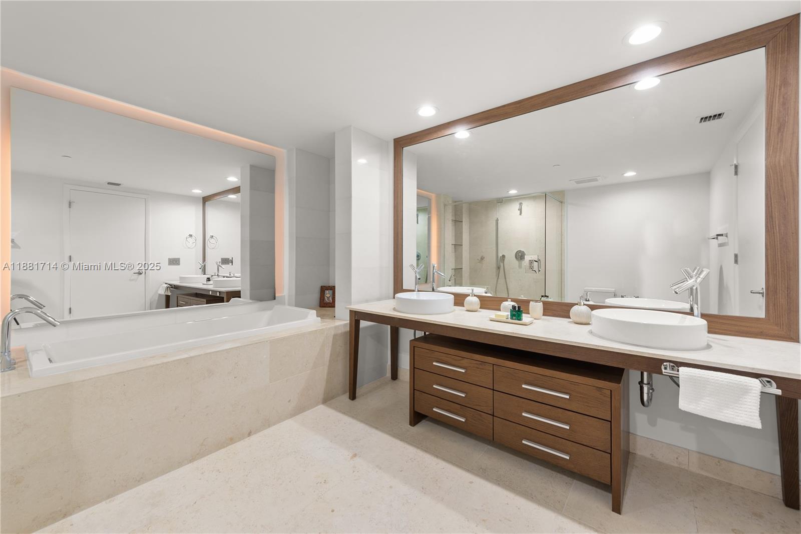 495 Brickell Avenue, Unit 5003 Miami, FL 33131 - Photo 19 of 21 a large bathroom with a double vanity sink mirror and a bathtub