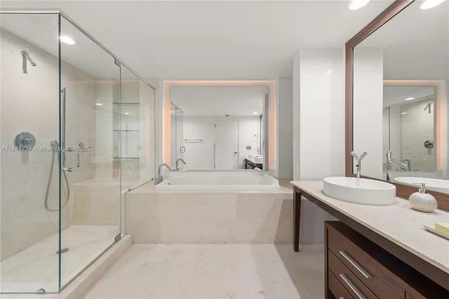 a bathroom with a bathtub and a sink