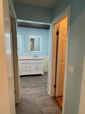 a view of a room that has a bed in it