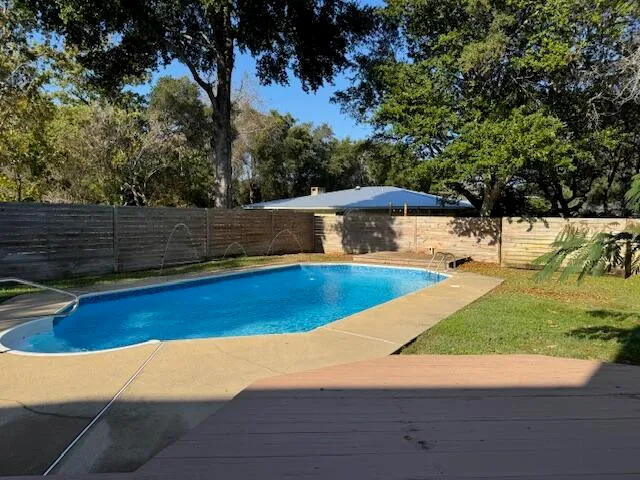 a view of a swimming pool with an outdoor space