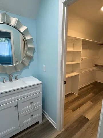 a bathroom with a toilet sink and a mirror