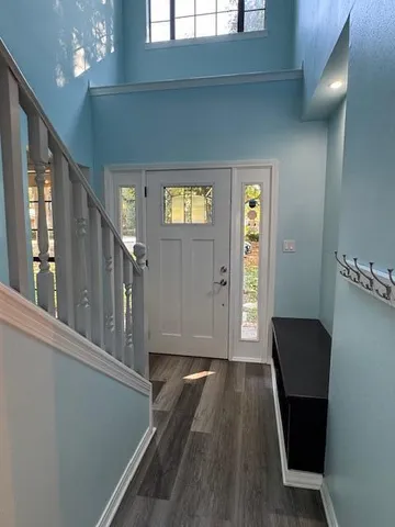 a view of gallery with wooden floor