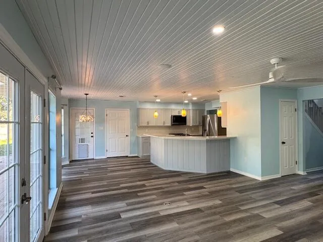 a view of a kitchen with a sink and cabinets