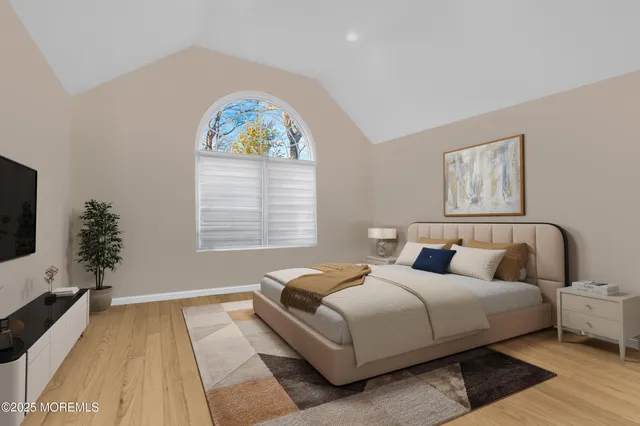 a bathroom with a tub a sink and a window