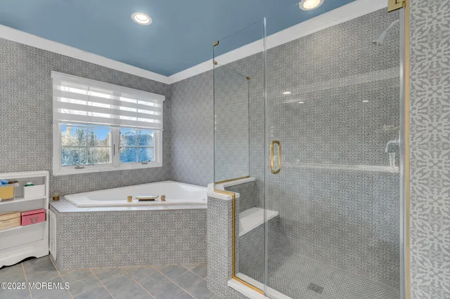 a bathroom with a tub shower and sink