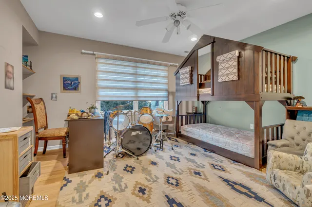 a bedroom with bed and a window