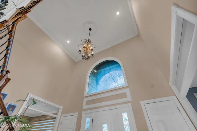 a view of a hallway with a chandelier