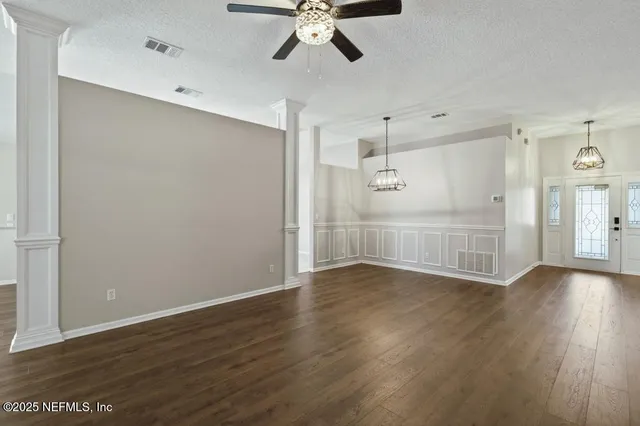 a bathroom with a sink a toilet and a shower curtain